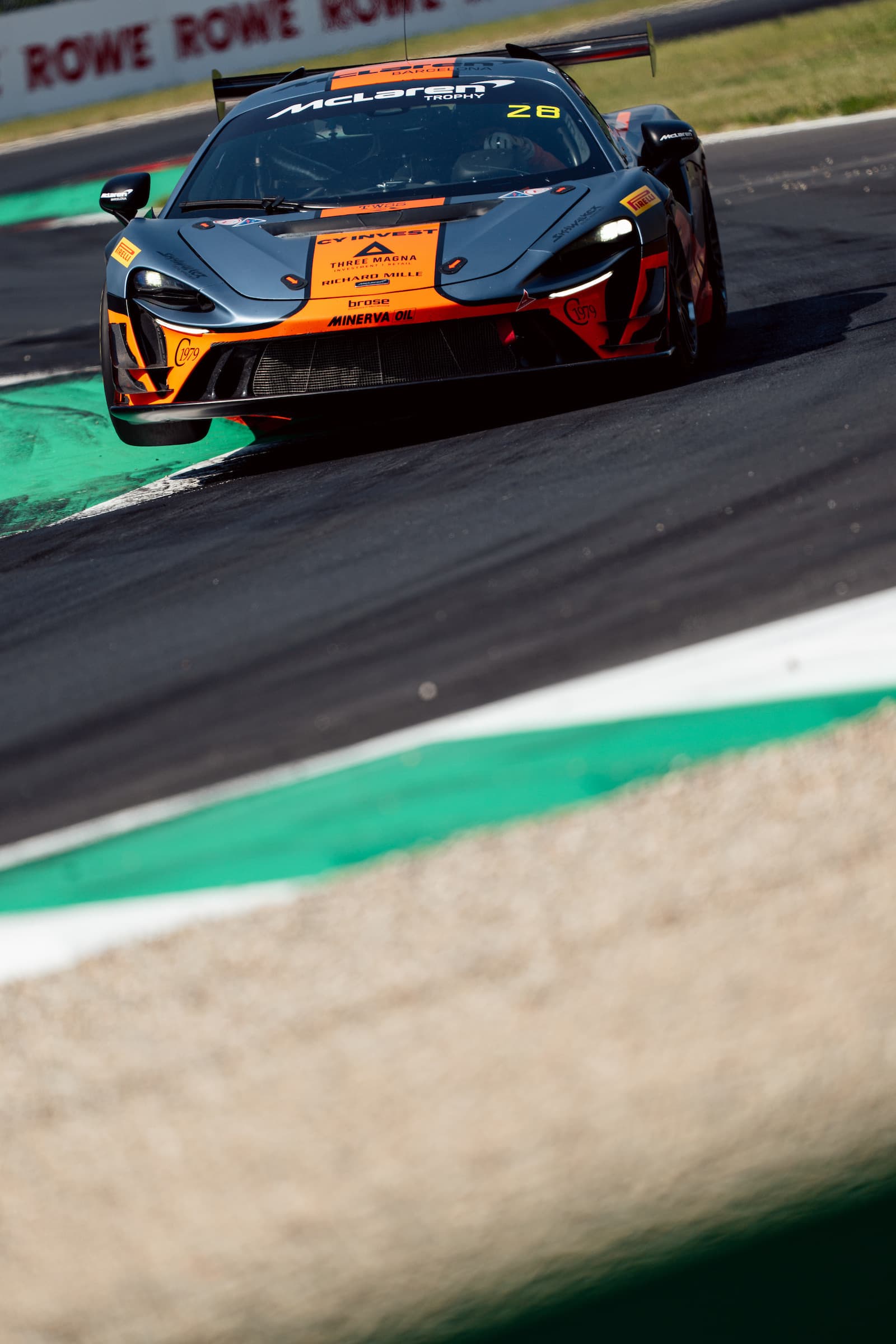 Orange and grey McLaren Artura Trophy, Mugello corner